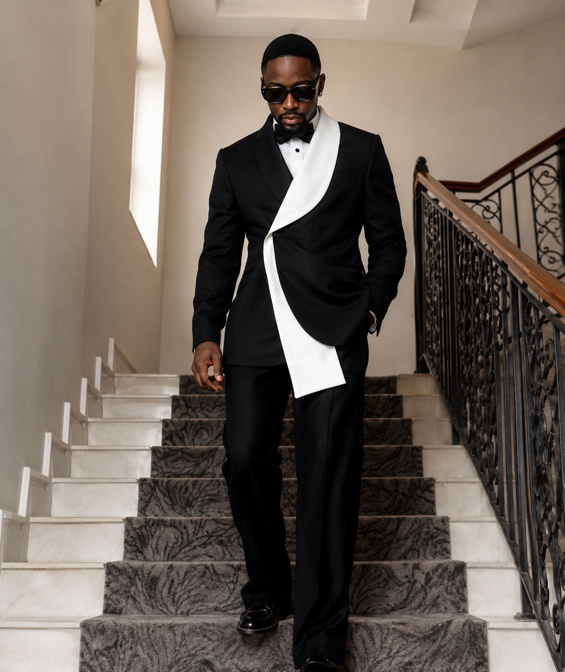 Black tailored tuxedo with contrasting white lapel detail.